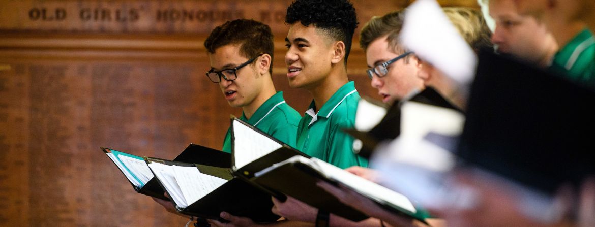 boys in row singing